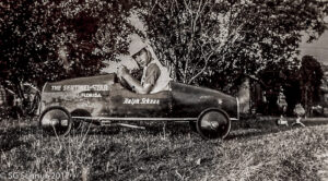 Boy Snuffy in his soapbox derby racer